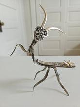 Handcrafted 5" x 4" praying mantis sculpture made from vintage silverware. Unique, whimsical art with gemstone accents and aged patina for mindful décor.