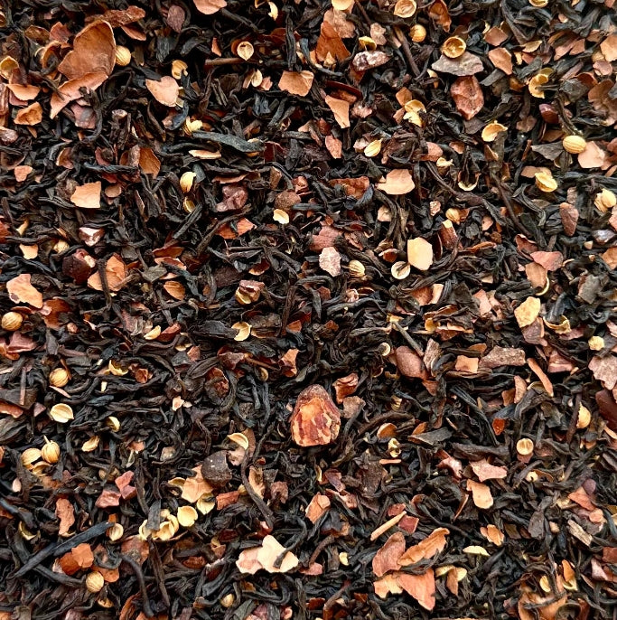 Indulge in Dark Chocolate Black Tea by Steep Society. A rich loose-leaf blend of black tea, cocoa nibs, and cocoa peel with bold chocolate flavor and a smooth finish.