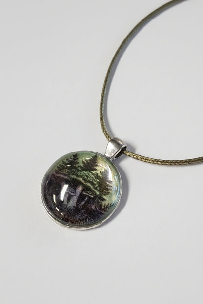 Handcrafted nature scene necklaces with real botanicals in iridescent and clear resin. Unique, wearable landscapes on chain or satin cord.
