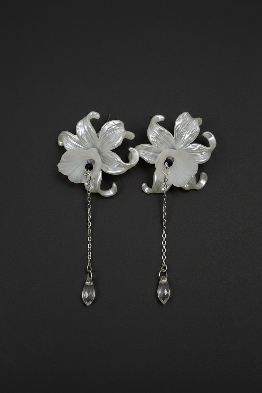 Hand-beaded Poison Garden earrings inspired by foxglove, wolfsbane, belladonna, datura, henbane and lily of the valley. Beautifully deadly botanical jewelry.