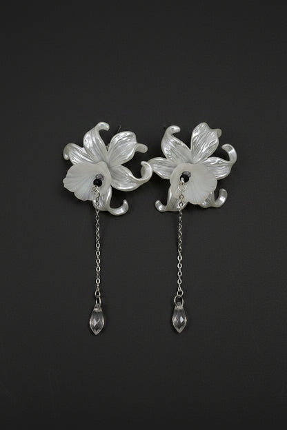 Hand-beaded Poison Garden earrings inspired by foxglove, wolfsbane, belladonna, datura, henbane and lily of the valley. Beautifully deadly botanical jewelry.