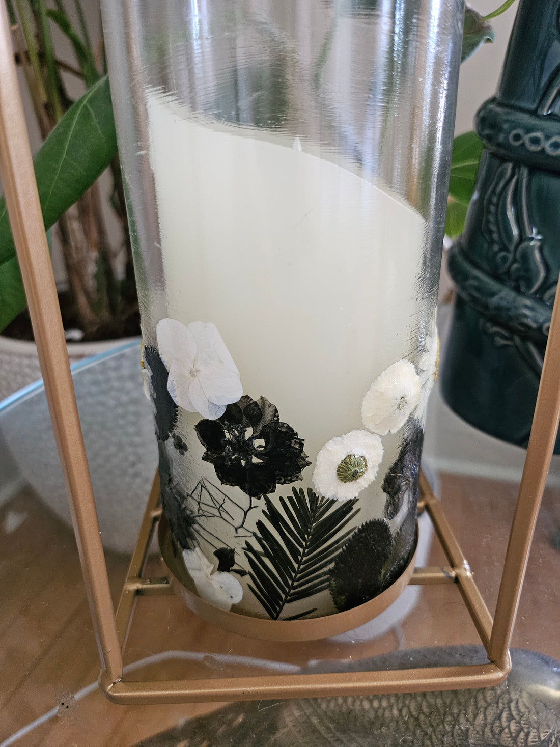 Fairy Pressed Flower Lantern with gold frame & glass panels glows with soft candlelight through real black & white flowers. 12" tall, perfect for spa or gift.