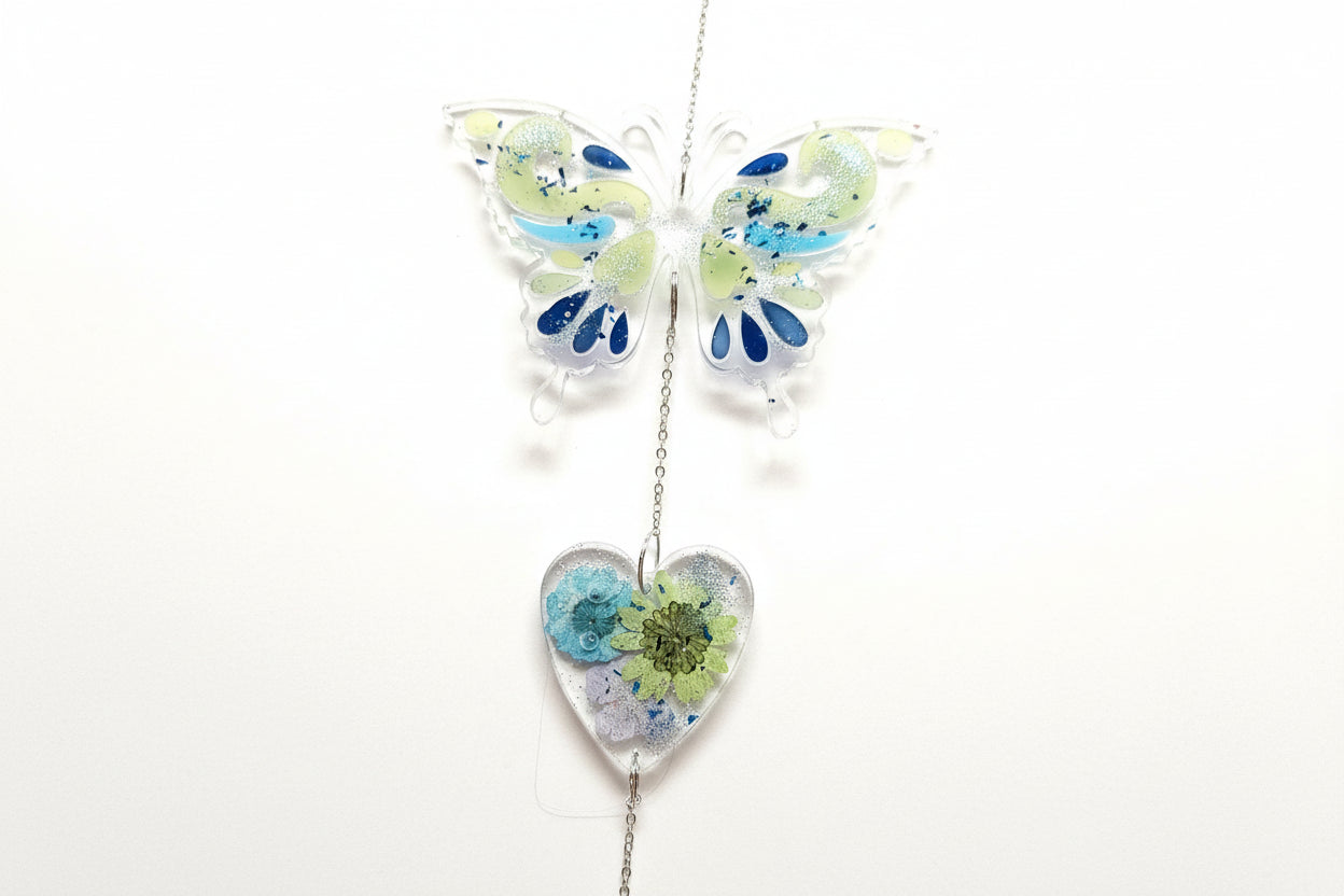 Handmade butterfly suncatchers with real pressed flowers and crystal chain. Reflects sunlight into rainbows—perfect for windows or near plants.