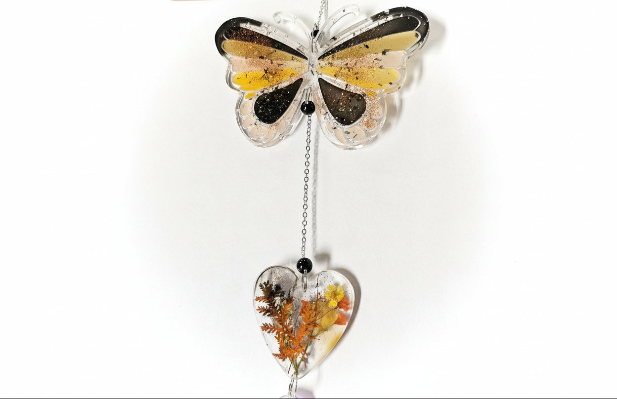 Handmade butterfly suncatchers with real pressed flowers and crystal chain. Reflects sunlight into rainbows—perfect for windows or near plants.