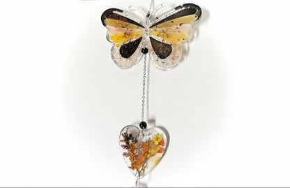 Handmade butterfly suncatchers with real pressed flowers and crystal chain. Reflects sunlight into rainbows—perfect for windows or near plants.