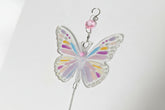 Handmade butterfly suncatchers with real pressed flowers and crystal chain. Reflects sunlight into rainbows—perfect for windows or near plants.