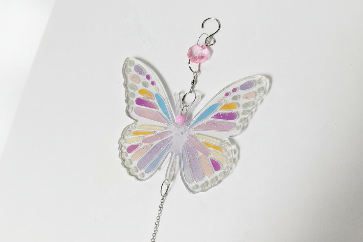 Handmade butterfly suncatchers with real pressed flowers and crystal chain. Reflects sunlight into rainbows—perfect for windows or near plants.