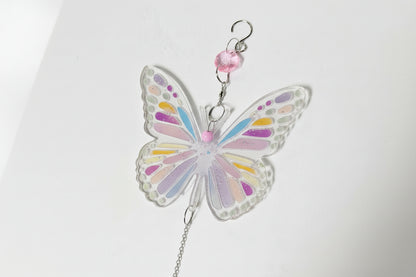 Handmade butterfly suncatchers with real pressed flowers and crystal chain. Reflects sunlight into rainbows—perfect for windows or near plants.