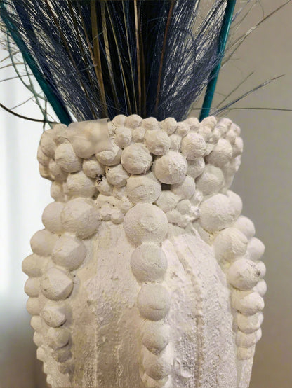 Elevate your decor with this handcrafted upcycled glass urn-shaped vase, made from reclaimed materials for a sustainable touch. Available in Glossy Black or Matte White, each unique piece offers artistic flair and eco-friendly style. Perfect for fresh or dried flowers, it suits both indoor and covered outdoor spaces.