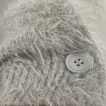 Luxuriously soft fluffy V-neck button-down cardigan with relaxed fit and cozy texture. Wear on or off shoulder—perfect for chic fall and winter layering.