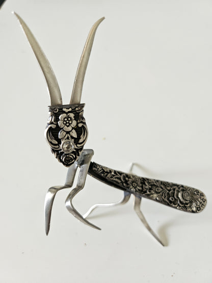 Handcrafted 5&quot; x 4&quot; praying mantis sculpture made from vintage silverware. Unique, whimsical art with gemstone accents and aged patina for mindful décor.