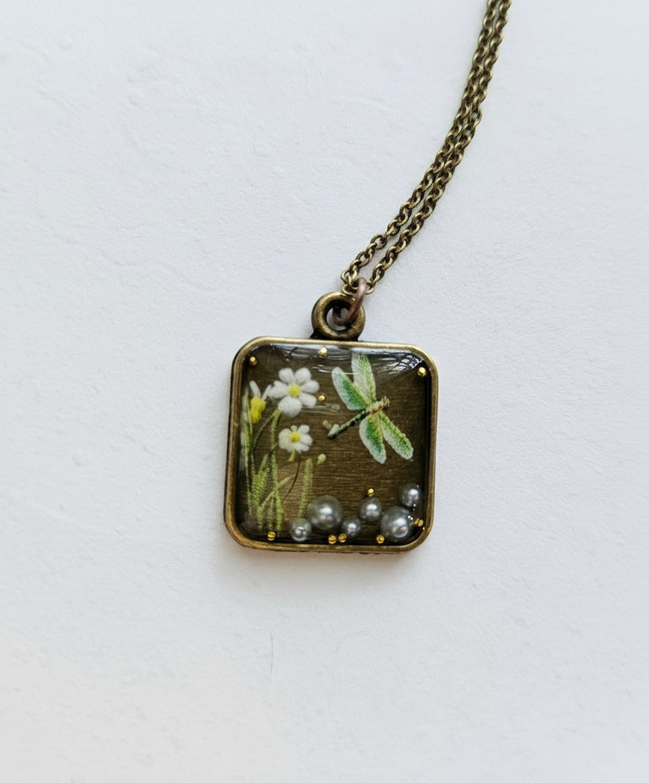 Gathered-in-the-Wild Botanical Necklace with real foraged flowers, mushrooms, pine needles, and leaves preserved in resin. Handcrafted wearable nature art by KStonely.