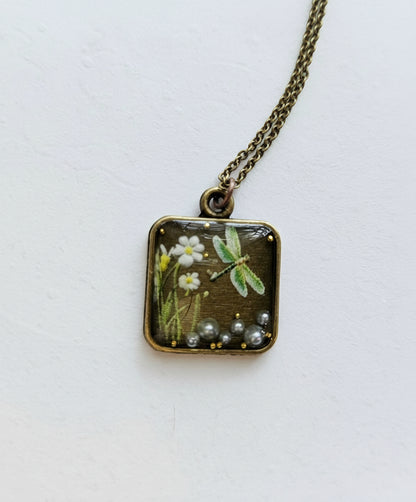 Gathered-in-the-Wild Botanical Necklace with real foraged flowers, mushrooms, pine needles, and leaves preserved in resin. Handcrafted wearable nature art by KStonely.