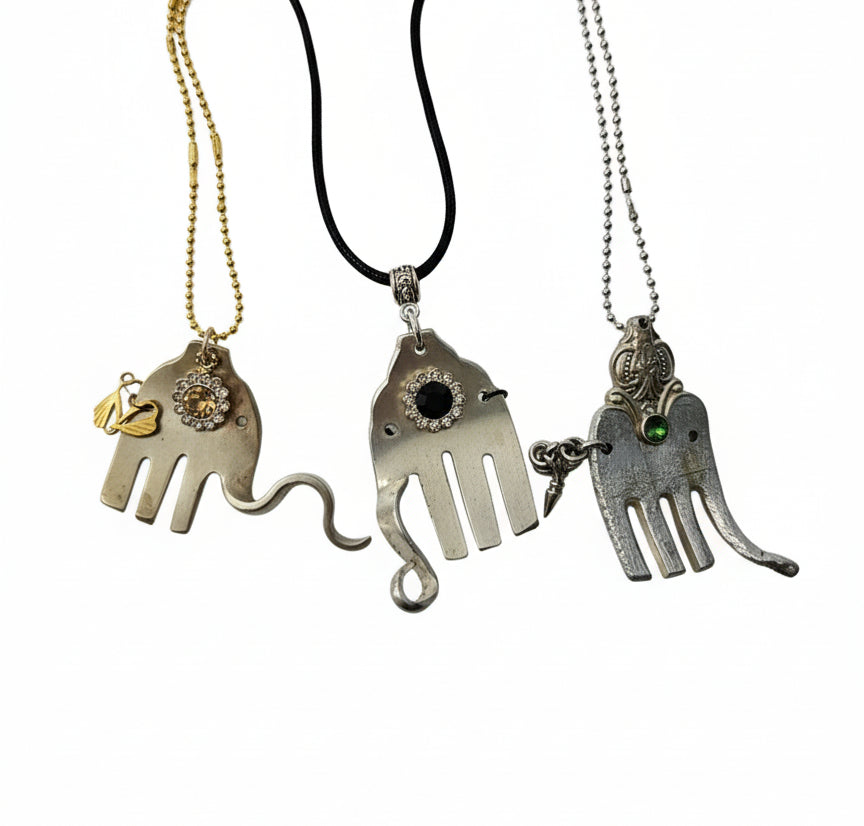 Handcrafted silver elephant pendant made from vintage silverware. Symbolizes strength, wisdom &amp; luck. Eco-friendly, one-of-a-kind, and artisan-made in the USA.