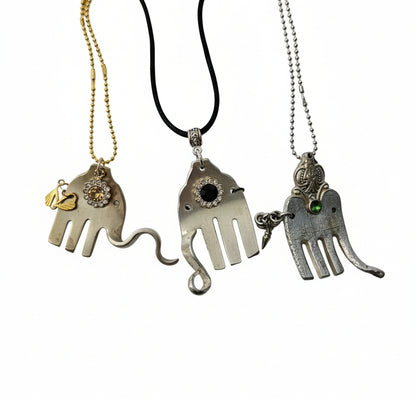 Handcrafted silver elephant pendant made from vintage silverware. Symbolizes strength, wisdom &amp; luck. Eco-friendly, one-of-a-kind, and artisan-made in the USA.