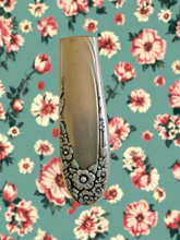 Whimsical bud vases crafted from vintage silverware with magnetic backs—perfect for single blooms and small clippings. Each one is a one-of-a-kind treasure.