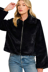 Wrap yourself in cozy elegance with our cropped Faux Fur Jacket with pockets. A plush, versatile layer for everyday outfits, romantic evenings, and seasonal style.