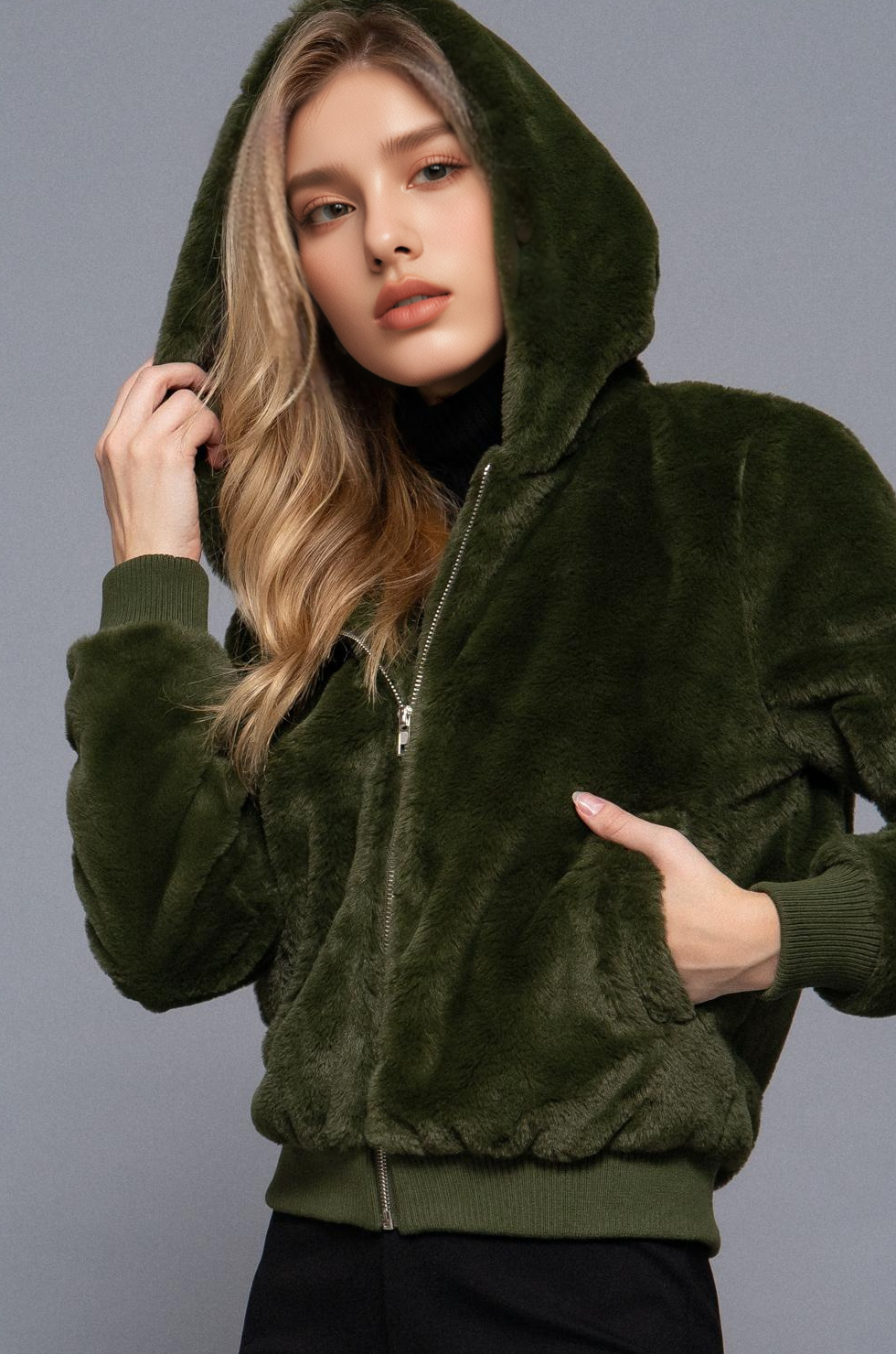 Faux fur zip-up hoodie fall jacket made from 100% polyester. Soft, plush, and cozy with a hood and pockets—perfect for layering in autumn and winter.