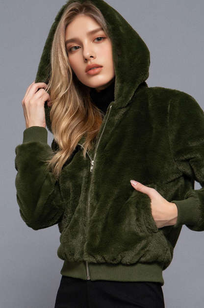 Faux fur zip-up hoodie fall jacket made from 100% polyester. Soft, plush, and cozy with a hood and pockets—perfect for layering in autumn and winter.