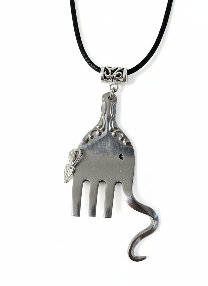 Handcrafted silver elephant pendant made from vintage silverware. Symbolizes strength, wisdom &amp; luck. Eco-friendly, one-of-a-kind, and artisan-made in the USA.