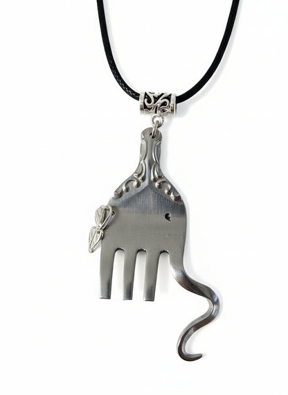 Handcrafted silver elephant pendant made from vintage silverware. Symbolizes strength, wisdom &amp; luck. Eco-friendly, one-of-a-kind, and artisan-made in the USA.
