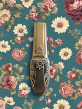 Whimsical bud vases crafted from vintage silverware with magnetic backs—perfect for single blooms and small clippings. Each one is a one-of-a-kind treasure.
