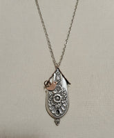 Handcrafted silver birdhouse pendant made from vintage silverware. A whimsical, one-of-a-kind necklace perfect for nature lovers and vintage jewelry fans.