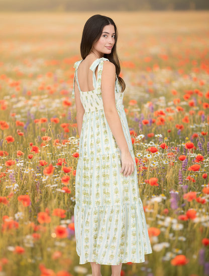 Romantic floral stripe midi dress with tie straps, square neckline, smocked back, and tiered ruffle details. Soft, feminine, and effortlessly elegant.