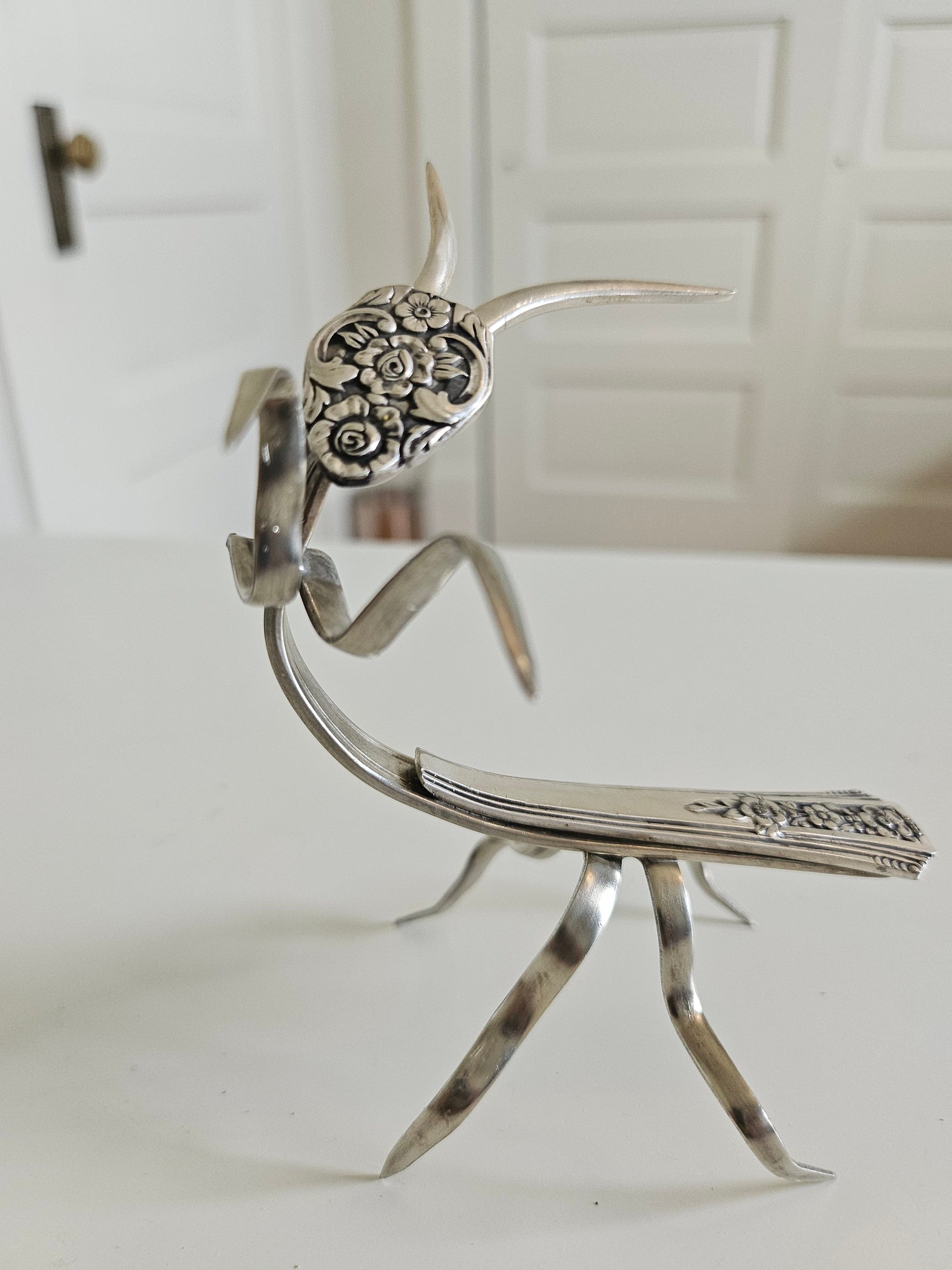 Handcrafted 5&quot; x 4&quot; praying mantis sculpture made from vintage silverware. Unique, whimsical art with gemstone accents and aged patina for mindful décor.