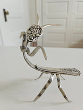Handcrafted 5" x 4" praying mantis sculpture made from vintage silverware. Unique, whimsical art with gemstone accents and aged patina for mindful décor.