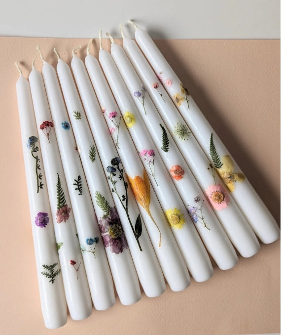 Flower taper candle workshop at Jungle Relics + Relic. Create 2 botanical candles with pressed flowers, sip tea, and enjoy a cozy creative experience.