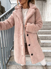 Wrap up in our Fuzzy Teddy Coat, featuring plush faux fur, a classic lapel collar, and a relaxed fit. A cozy, chic layer for fall days and winter evenings out.