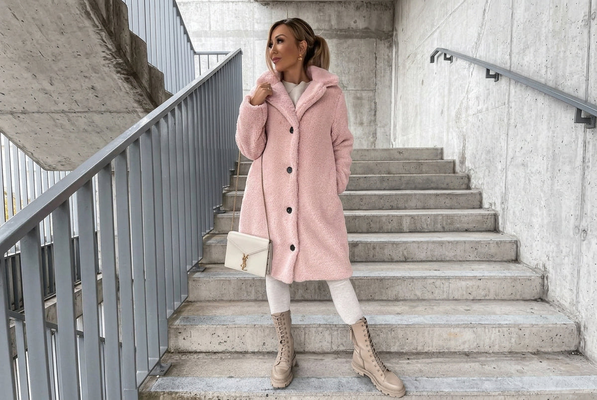 Wrap up in our Fuzzy Teddy Coat, featuring plush faux fur, a classic lapel collar, and a relaxed fit. A cozy, chic layer for fall days and winter evenings out.