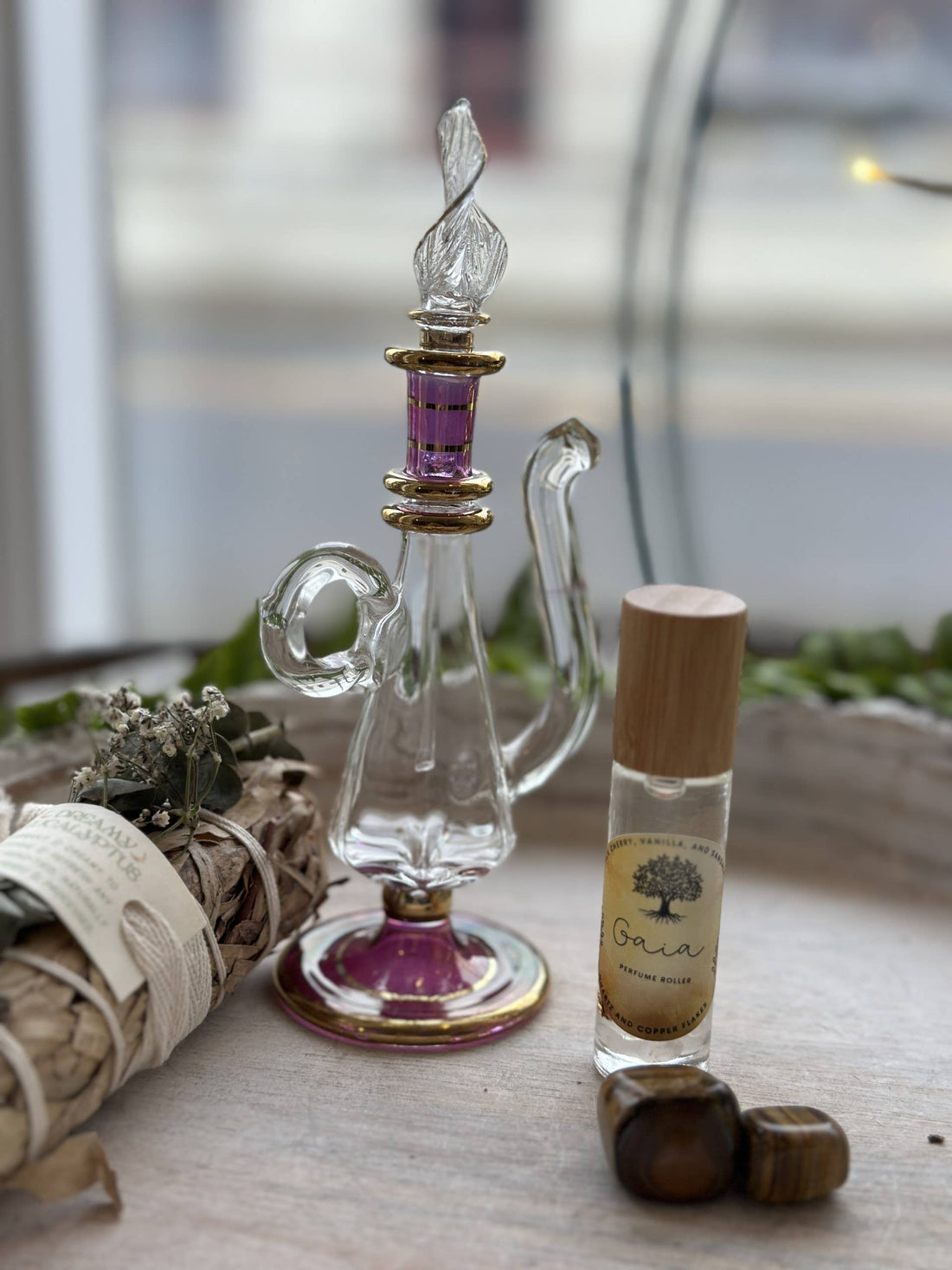 Gaia Goddess Perfume Roller blends sandalwood, vanilla &amp; coconut oil with quartz &amp; copper flakes for a grounding, divine scent. Vegan &amp; hand-poured.