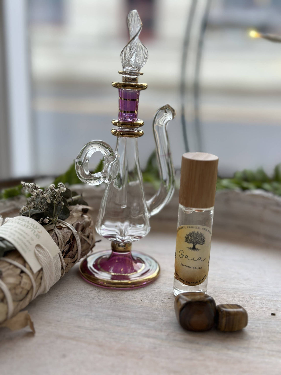 Gaia Goddess Perfume Roller blends sandalwood, vanilla &amp; coconut oil with quartz &amp; copper flakes for a grounding, divine scent. Vegan &amp; hand-poured.