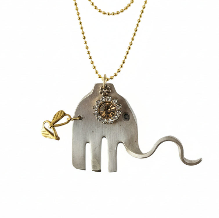 Handcrafted silver elephant pendant made from vintage silverware. Symbolizes strength, wisdom &amp; luck. Eco-friendly, one-of-a-kind, and artisan-made in the USA.