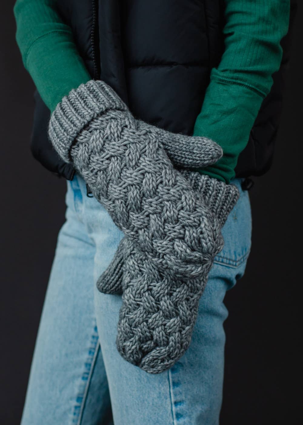 Gray knit mittens with cozy fleece lining. Made from 100% acrylic for warmth and durability. A classic winter essential for everyday cold-weather comfort.