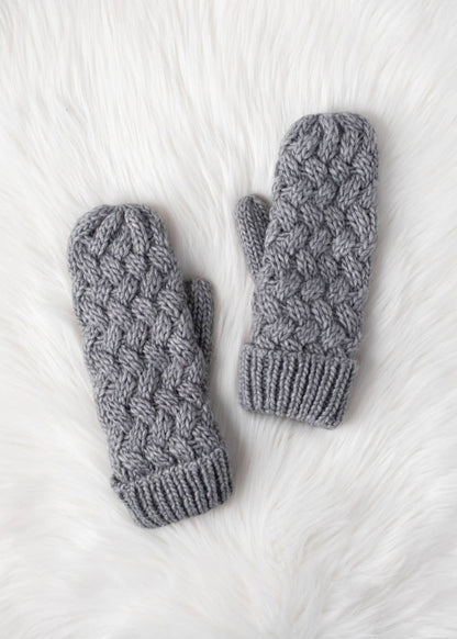 Gray knit mittens with cozy fleece lining. Made from 100% acrylic for warmth and durability. A classic winter essential for everyday cold-weather comfort.