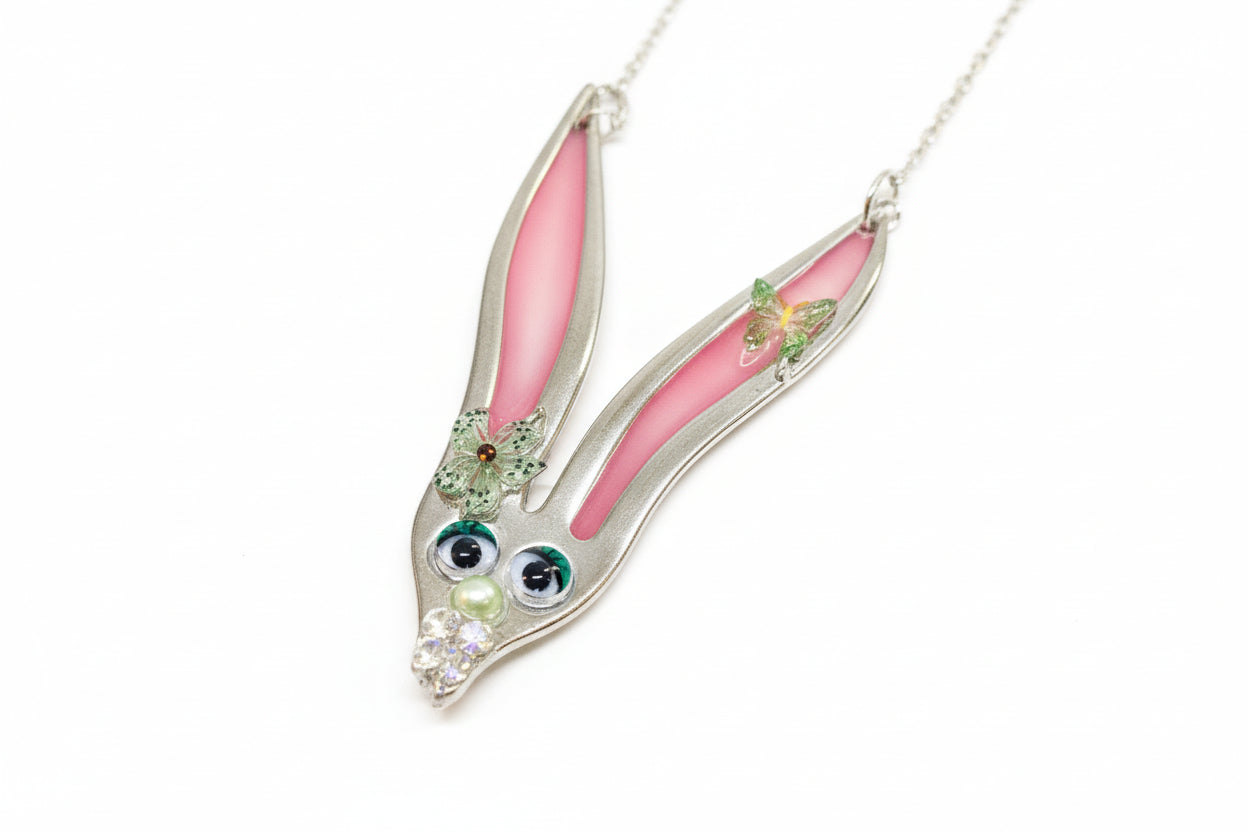 Whimsical fancy bunny pendant necklace handcrafted from vintage silverware, resin, and beads. One-of-a-kind Easter or everyday jewelry with vintage charm.