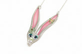 Whimsical fancy bunny pendant necklace handcrafted from vintage silverware, resin, and beads. One-of-a-kind Easter or everyday jewelry with vintage charm.