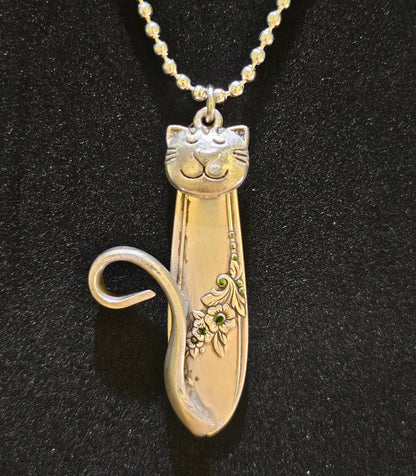 Handmade silver cat pendant necklaces from vintage silverware. Elegant, whimsical, and adjustable on a satin cord. Sustainably crafted and one-of-a-kind.