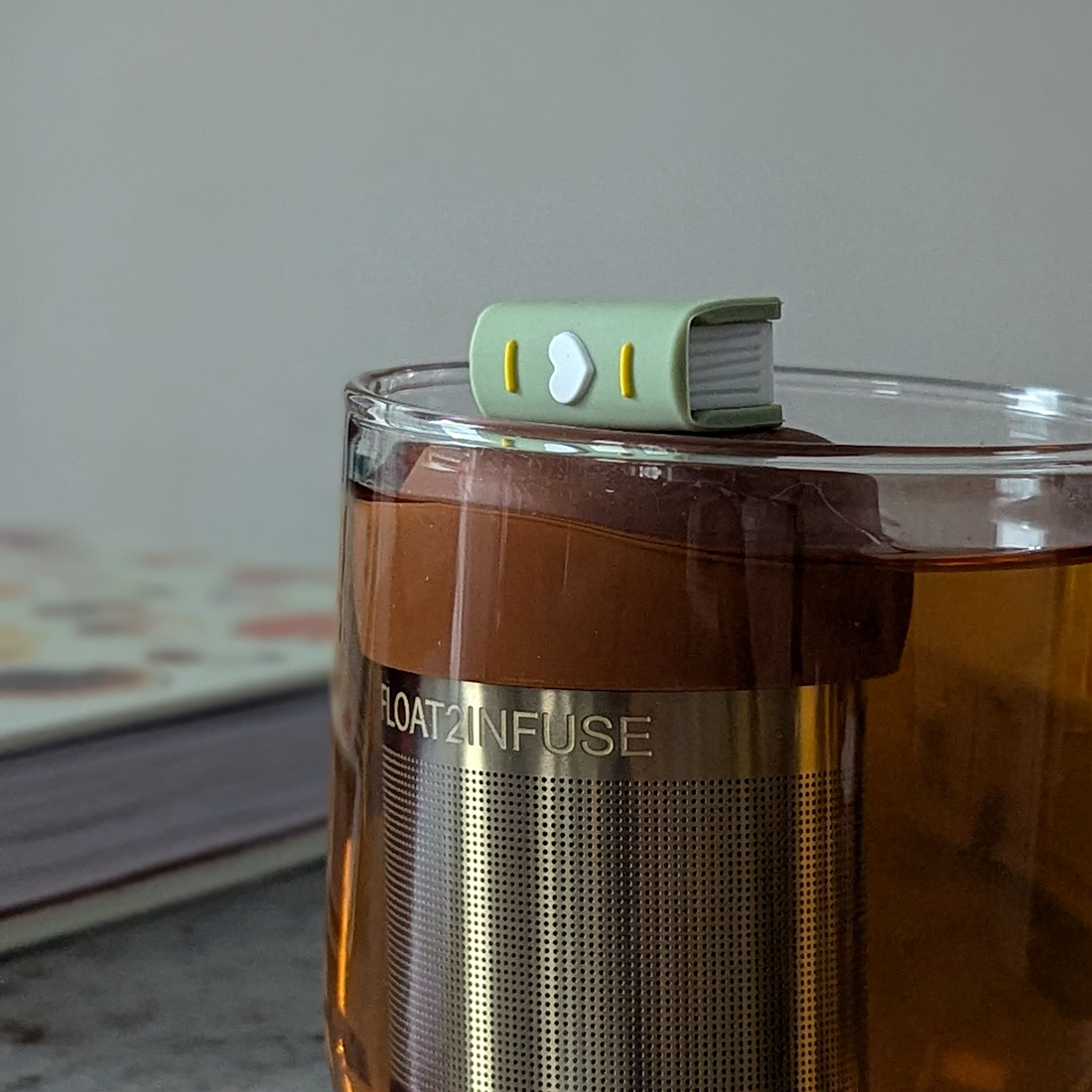 Green Heart Book Tea Steeper makes loose leaf tea easy in any mug. Reusable, dishwasher safe, eco-friendly. A charming gift for tea and book lovers.