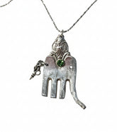 Handcrafted silver elephant pendant made from vintage silverware. Symbolizes strength, wisdom & luck. Eco-friendly, one-of-a-kind, and artisan-made in the USA.