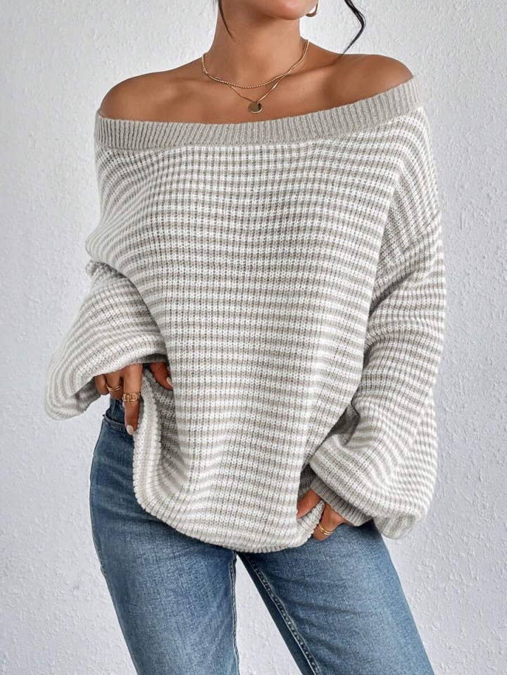 Cozy colorblocked striped one-shoulder knit sweater with relaxed fit and soft fabric. Wear off-shoulder or boat neck. Perfect for fall layering with denim or skirts.