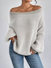 Cozy colorblocked striped one-shoulder knit sweater with relaxed fit and soft fabric. Wear off-shoulder or boat neck. Perfect for fall layering with denim or skirts.