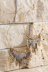 Shimmering beaded tassel chandelier earrings with a lightweight metal ring, hypoallergenic fish hooks, and dazzling glass beads—perfect for any occasion! 