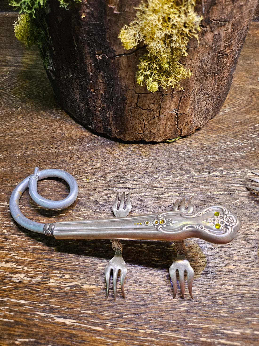 Handcrafted lizard sculpture made from vintage silverware. A whimsical, one-of-a-kind art piece symbolizing luck, renewal, and sun-loving charm.