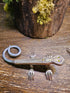Handcrafted lizard sculpture made from vintage silverware. A whimsical, one-of-a-kind art piece symbolizing luck, renewal, and sun-loving charm.