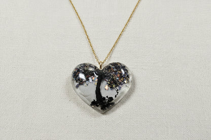 Handcrafted Tree of Life resin heart necklace on chain, symbolizing growth, connection, and balance. One-of-a-kind wearable art with soulful, nature-inspired design.