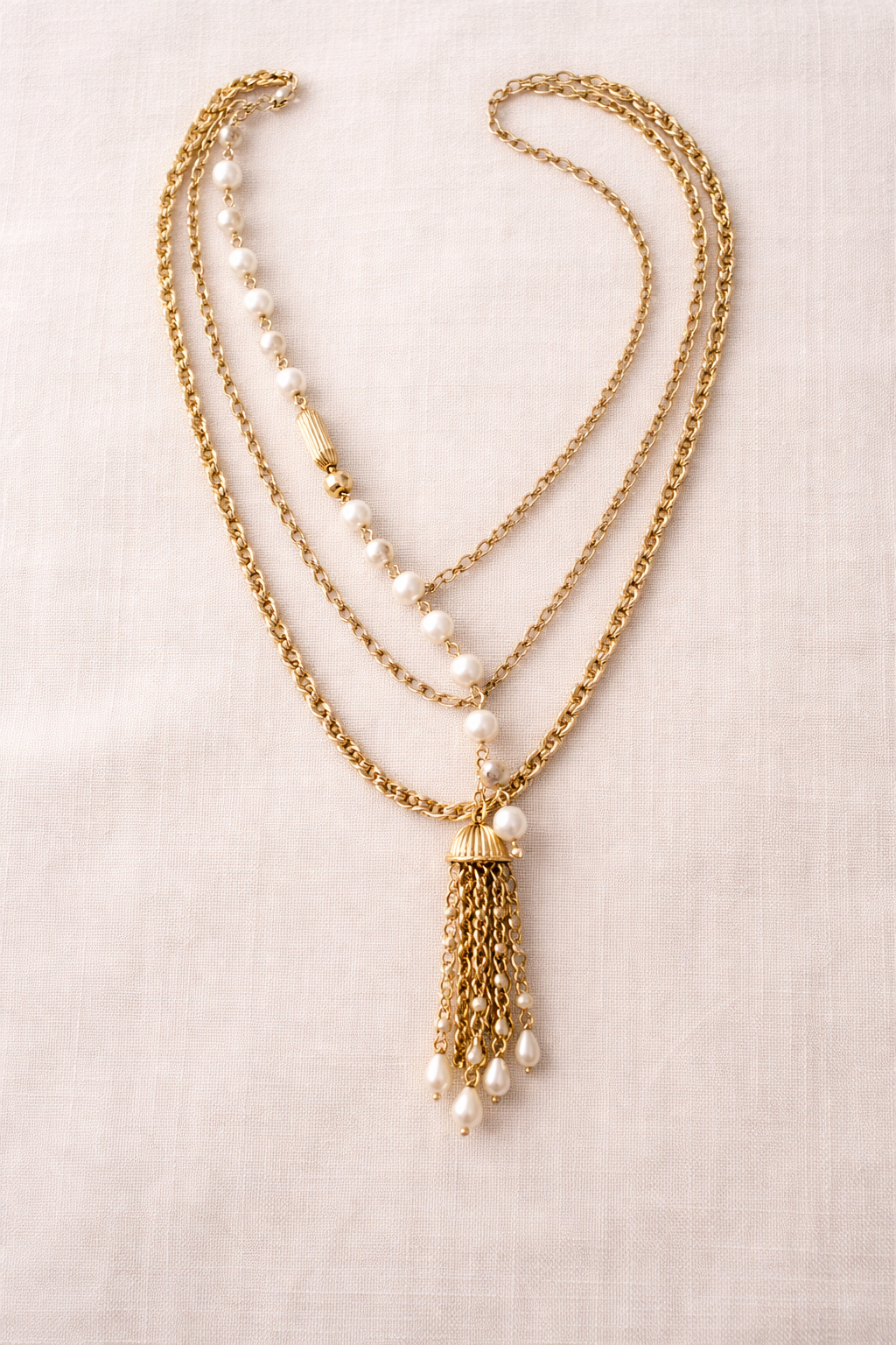 Handcrafted gold and pearl layered necklace by KStonely featuring cascading chains and tassel detail. Elegant, artistic, and truly one of a kind